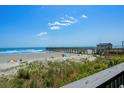 Captivating view of the beach and pier from the condo; perfect for a serene coastal lifestyle at 6000 N Ocean Blvd. # 119, North Myrtle Beach, SC 29582