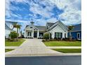 Inviting single-Gathering home with manicured lawn and a concrete driveway with nice landscaping at 7040 Belancino Blvd., Myrtle Beach, SC 29572