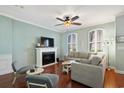 Comfortable living room features a fireplace, large windows, and ample seating for relaxation at 750 Howard Ave. # C, Myrtle Beach, SC 29577