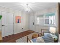 Sitting area featuring wood-look floors, wainscotting and stylish furnishings at 824 N Waccamaw Dr. # 204, Murrells Inlet, SC 29576