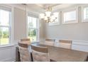 Elegant dining room showcasing neutral walls, and large windows offering lots of natural light at 905 Monmouth Dr., Myrtle Beach, SC 29588