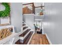 Hallway with stairs leading to upstairs loft, and hardwood floors at 104 Splendor Circle, Murrells Inlet, SC 29576