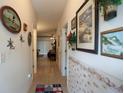 Inviting hallway with tile flooring and coastal decor creating a warm and welcoming atmosphere at 1058 Sea Mountain Hwy. # 3-201, North Myrtle Beach, SC 29582