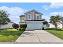 Charming two-story home featuring a two-car garage, well-maintained lawn, and neatly trimmed hedges at 1209 Eagle Creek Dr., Myrtle Beach, SC 29588