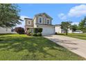 Charming two-story home featuring a two-car garage, well-maintained lawn, and neatly trimmed hedges at 1209 Eagle Creek Dr., Myrtle Beach, SC 29588