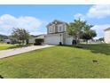 Inviting two-story home showcasing a manicured lawn and a two-car garage at 1209 Eagle Creek Dr., Myrtle Beach, SC 29588