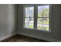 Inviting bedroom with large windows offering scenic neighborhood views and ample natural light at 1424 Hydrangea Dr., Myrtle Beach, SC 29579