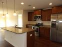 Modern kitchen featuring granite countertops, stainless steel appliances, and wood cabinets at 192 Mountain Ash Ln., Myrtle Beach, SC 29579