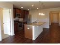 Open kitchen area with granite countertops, stainless appliances, and stylish pendant lighting at 192 Mountain Ash Ln., Myrtle Beach, SC 29579