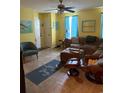 Comfortable living room with tile floors, a sectional sofa, and natural light from the window at 2005 Greens Blvd. # F-205, Myrtle Beach, SC 29577