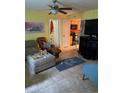 Cozy living room featuring tile floors, comfortable furniture, and an open doorway to the kitchen at 2005 Greens Blvd. # F-205, Myrtle Beach, SC 29577