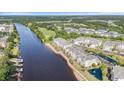 Riverside condos with golf course and neighborhood views, featuring well-maintained landscaping and waterfront access at 2180 Waterview Dr. # 725, North Myrtle Beach, SC 29582