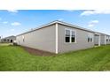 A green lawn compliments the gray siding of this one story home at 2859 Riverboat Way, Conway, SC 29526