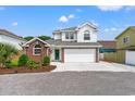 Stately two-story home boasts brick accents, a two-car garage, and professional landscaping at 4002 Acorn Way, North Myrtle Beach, SC 29582