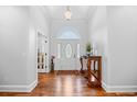 Bright foyer features hardwood floors, a decorative table and elegant lighting at 423 Chapman Loop, Pawleys Island, SC 29585