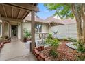 A cozy patio with a dining table and brick accents offers a charming outdoor spot for dining and relaxation at 430 Ocean Creek Dr. # 2534, Myrtle Beach, SC 29572