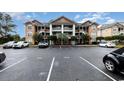 Condominium complex with convenient parking and manicured landscaping for a welcoming atmosphere at 4633 Lightkeepers Way # 5-F, Little River, SC 29566