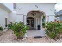 Inviting front porch with elegant columns, detailed stonework, and lush greenery, creating a warm welcome at 616 Edgecreek Dr., Myrtle Beach, SC 29579