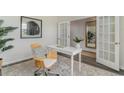 Cozy home office with a comfortable chair, white desk, modern decor, and ample natural light at 7431 Meadow Walk Loop, Loris, SC 29569