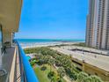 Balcony view with ocean, beach, and pool views from a high-rise condo at 8560 Queensway Blvd. # 508, Myrtle Beach, SC 29572