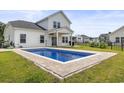 Beautiful backyard with a private pool, patio, and well-maintained lawn at 863 Agostino Dr., Myrtle Beach, SC 29579