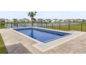 Stunning private pool with a lake view and a palm tree, perfect for relaxing and entertaining at 863 Agostino Dr., Myrtle Beach, SC 29579