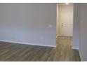 Hallway featuring neutral paint, light-colored flooring, and a white door at 8715 Baton Rouge Ave Nw, Calabash, NC 28467