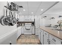 Bright kitchen featuring white cabinetry, modern appliances, and ample counter space at 1210 N Waccamaw Dr. # 1105, Murrells Inlet, SC 29576