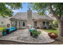 Backyard patio featuring outdoor seating, a fire pit, and a well-maintained lawn for relaxing outdoors at 140 Avondale Dr., Myrtle Beach, SC 29588