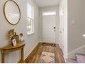 Inviting home entryway with hardwood floors, a stylish mirror, and plenty of natural light at 1403 Nokota Dr., Conway, SC 29526