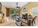 Cozy living room featuring a fireplace and access to an outdoor deck at 201 Westleton Dr. # 10-I, Myrtle Beach, SC 29572