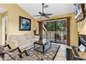Bright living room with sliding glass doors and comfortable seating at 201 Westleton Dr. # 10-I, Myrtle Beach, SC 29572