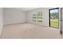 Bright, carpeted living room with lots of natural light at 203 Longwood Ln., Conway, SC 29527