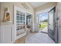 Bright foyer with French doors leading to an office and a decorative front door at 2300 Lark Sparrow St., Myrtle Beach, SC 29577