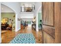 Grand foyer with soaring ceilings, hardwood floors, an upper balcony, and access to the living spaces at 2382 Waverly Rd., Pawleys Island, SC 29585