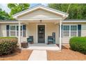 Welcoming front porch featuring comfortable seating and a 'Welcome' sign at 2510 Redwood St., Georgetown, SC 29440