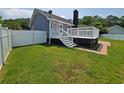 Lovely backyard with a spacious deck and lush green lawn, perfect for outdoor enjoyment at 302 Silver Fox Trail, Myrtle Beach, SC 29588