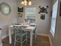 Bright dining area with decorative mirror, modern table setting, and lots of natural light at 304 S Magnolia Ave., Andrews, SC 29510