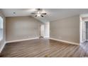 Well-lit living room with vaulted ceiling, wood floors, and neutral paint scheme at 3129 Slade Dr., Conway, SC 29526