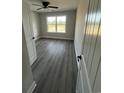 Bright bedroom with gray floors, a large window, and natural light at 3444 Asbury Rd., Aynor, SC 29511