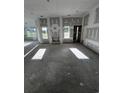 Unfinished living room featuring lots of natural light, a fireplace, and an open floor plan at 3530 Good Luck Rd., Aynor, SC 29511