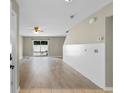 A bright living room features wood flooring, a ceiling fan, sliding doors, and fresh paint ready for personalization at 4013 Blackwolf Dr., Myrtle Beach, SC 29579