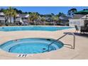 Community hot tub and pool with lounge chairs at 4319 Lotus Ct. # A, Murrells Inlet, SC 29576