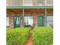 Charming entryway with lush green bushes and two units with doors and windows at 4516 Seaview St. # 137, North Myrtle Beach, SC 29582