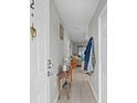 Bright entryway with light colored floors, table, and coat rack providing welcoming ambiance at 4648 Greenbriar Dr. # D2, Little River, SC 29566