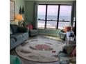 Cozy living room with ocean views, comfortable seating, and charming beach-themed decor at 523 S Ocean Blvd. # 705, North Myrtle Beach, SC 29582