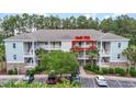 Condominium building with ample parking and outdoor balcony views at 6253 Catalina Dr. # 733, North Myrtle Beach, SC 29582