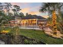 Beautiful backyard with a black metal fence surrounding a sparkling pool and furnished outdoor seating area at 81 Cascade Dr., Murrells Inlet, SC 29576