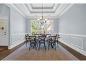 Dining room with coffered ceilings, natural light, and seating for six guests at 840 Jeter Ln., Myrtle Beach, SC 29588