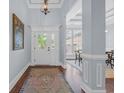 Elegant foyer with hardwood floors, soft blue walls, and decorative doorway at 840 Jeter Ln., Myrtle Beach, SC 29588